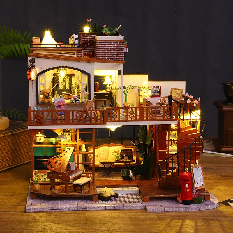 a model of a doll house with furniture and lights