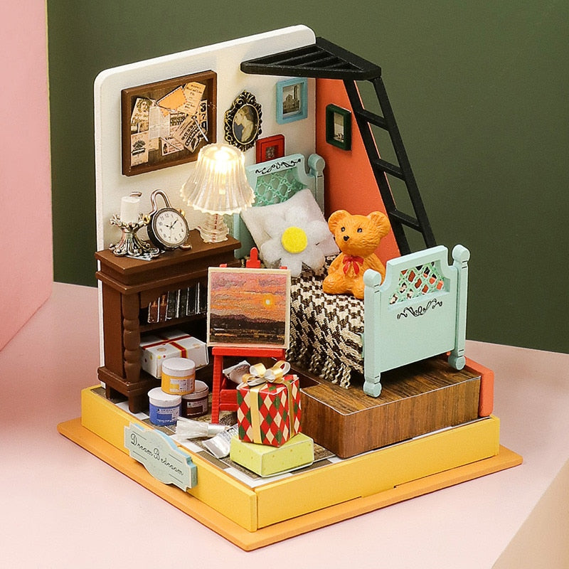 a doll house with furniture and accessories on a table