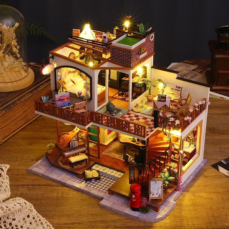 a doll house with lights and furniture on a table