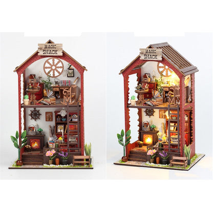 a doll house with a clock on top of it