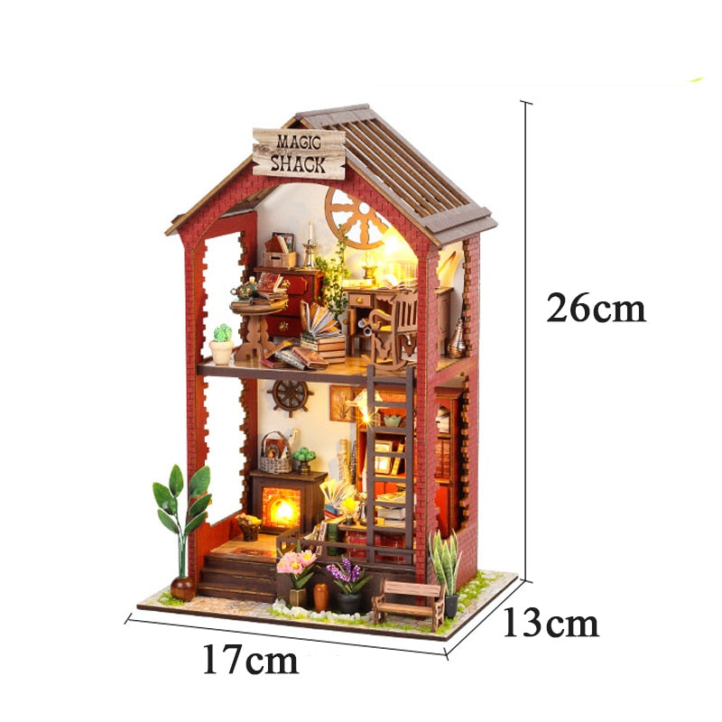 a wooden doll house with furniture and accessories